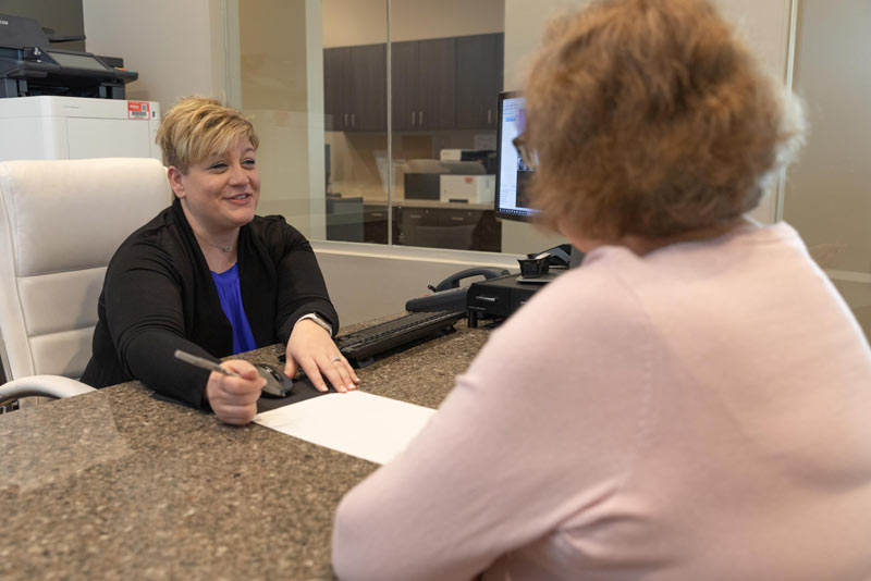 Patient signing paperwork